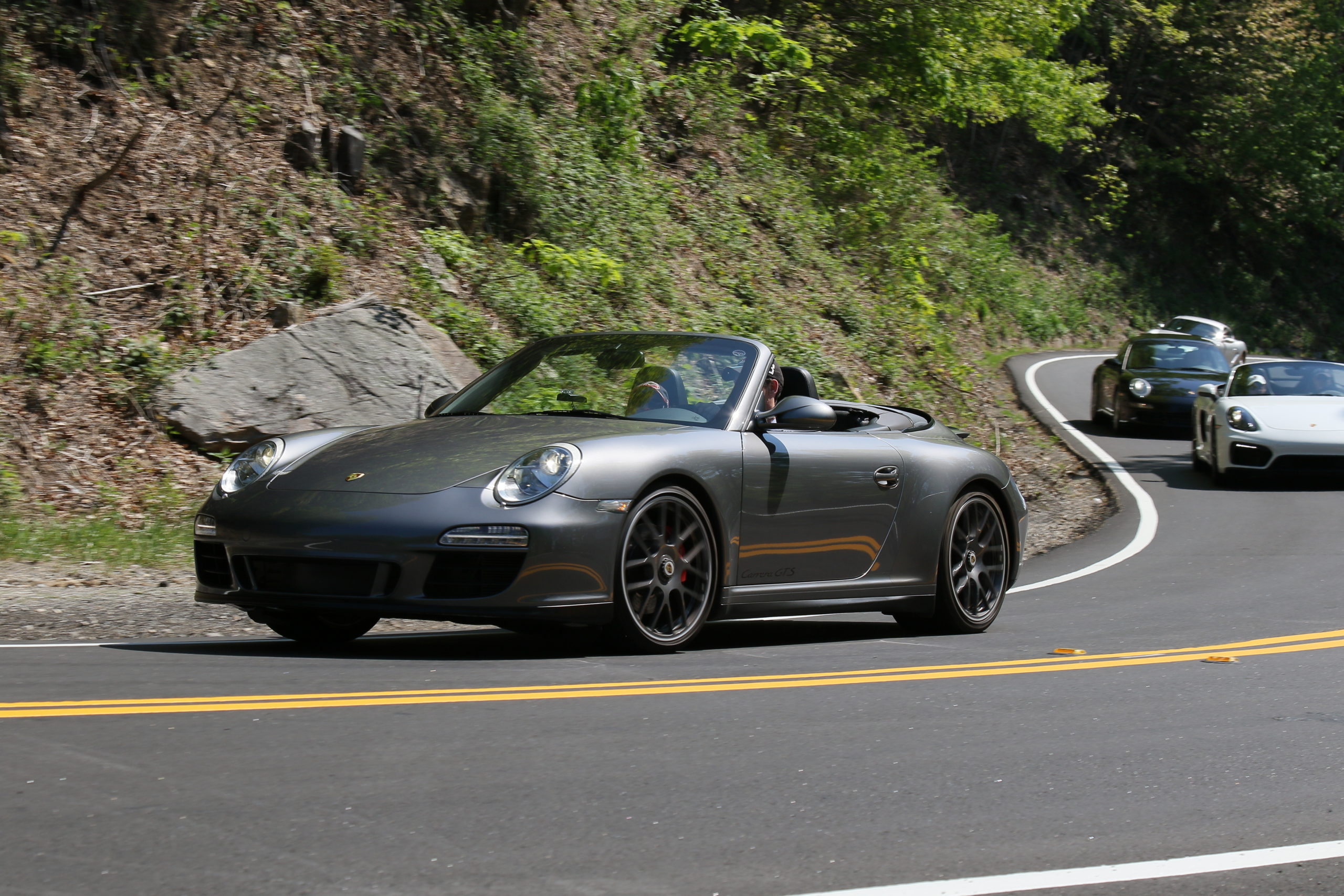 Enjoying a drive in a 2011 997 Carrera GTS Cabriolet with the top down.